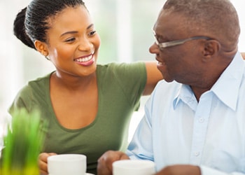 A woman and man visiting together.