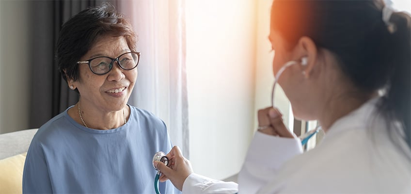 A doctor smiling with a patient.